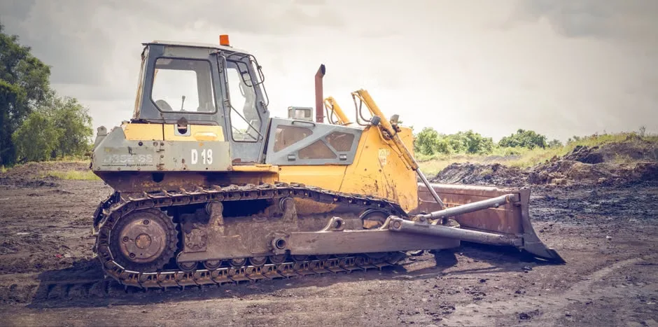 Bulldozer on a cleared lot during land clearing and grading in Florida