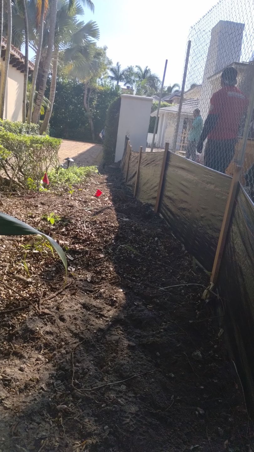 The trench method requires a trench to be dug, and the bottom 6 inches of mesh to be folde inwards, then backfilled.
